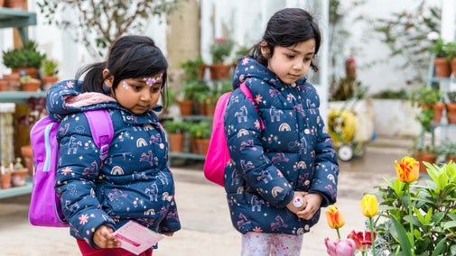 Visitors enjoying the flowers in the Glasshouse